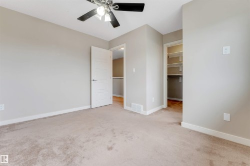 Carpeted room with a ceiling fan - 3340 15A Avenue Nw, Edmonton, AB 
