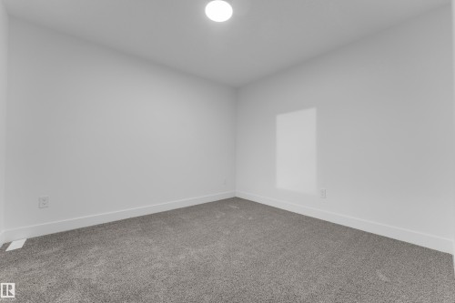 Recessed ceiling light fixture and gray carpeting - 236 Linden Loop, Leduc, AB 