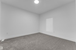 Recessed ceiling light fixture and gray carpeting - 