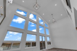Soaring vaulted ceiling with recessed lighting - 