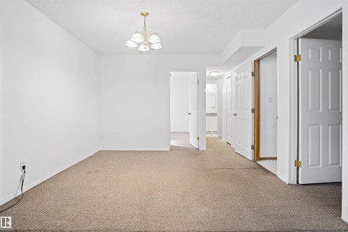 Recessed lighting, beige carpet flooring, and paneled interior doors - 2915 151A Avenue Nw, Edmonton, AB 
