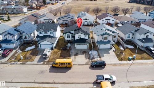 Two-story property with a double garage, front driveway, and gabled roofline - 2915 151A Avenue Nw, Edmonton, AB 