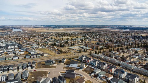 Expansive aerial perspective showcasing a residential neighborhood with diverse architectural styles - 2915 151A Avenue Nw, Edmonton, AB 