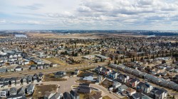 Expansive aerial perspective showcasing a residential neighborhood with diverse architectural styles - 