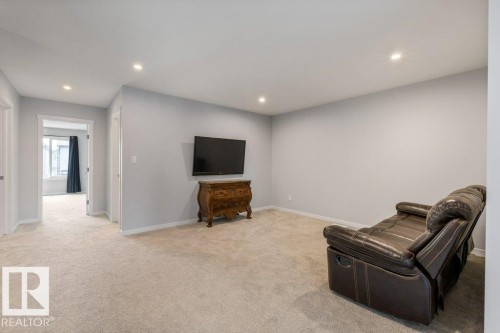 Carpeted interior space with light gray walls, recessed lighting, and white trim - 7113 177A Avenue Nw, Edmonton, AB - Indoor