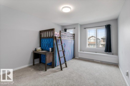 Spacious room with light gray walls and plush carpeting - 7113 177A Avenue Nw, Edmonton, AB - Indoor