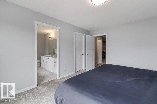 Bedroom featuring grey-toned walls and grey carpeting - 7113 177A Avenue Nw, Edmonton, AB - Indoor Photo Showing Bedroom