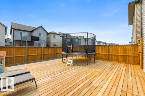 Spacious wood-plank deck with a perimeter wooden fence - 7113 177A Avenue Nw, Edmonton, AB - Outdoor With Deck Patio Veranda