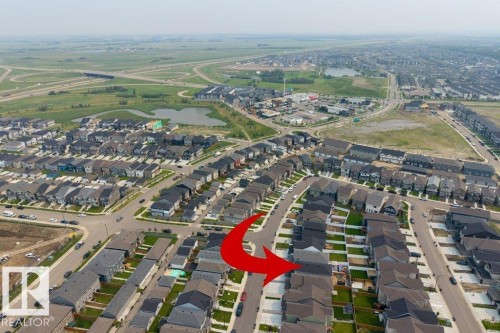 Aerial perspective showcasing a developed residential community with numerous single-family homes - 7113 177A Avenue Nw, Edmonton, AB - Outdoor With View