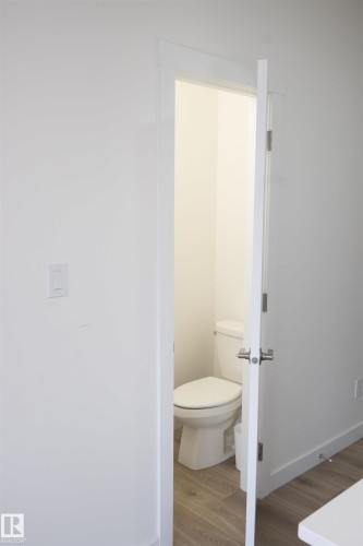 White interior door with brushed nickel hardware - #64 2710 66 St Sw Sw, Edmonton, AB 