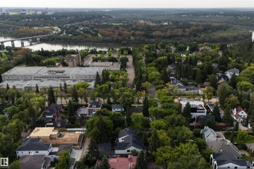 Aerial perspective highlighting the surrounding neighborhood, mature trees, and riverfront - 10223 130 Street Nw, Edmonton, AB 
