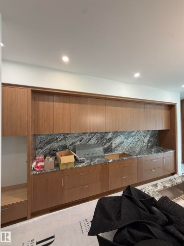 Full-height cabinetry, stone countertops, stone backsplash, recessed lighting, integrated sink - 10223 130 Street Nw, Edmonton, AB 