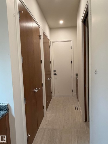 Recessed ceiling lighting, light-toned flooring, and brown wood-finish cabinetry - 10223 130 Street Nw, Edmonton, AB 