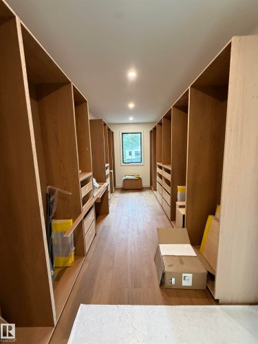 Custom built-in storage, wood-finish flooring, recessed lighting, and a window - 10223 130 Street Nw, Edmonton, AB 
