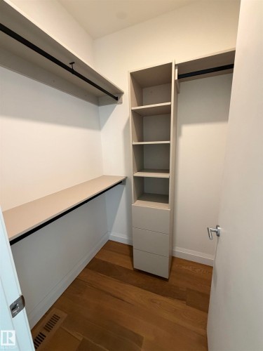 Custom closet system featuring built-in shelving, drawers, and hanging rods - 10223 130 Street Nw, Edmonton, AB 