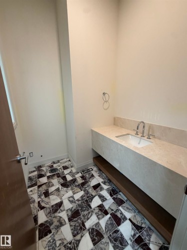 Floating vanity with an integrated basin and a neutral-toned countertop - 10223 130 Street Nw, Edmonton, AB 