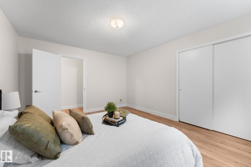 Recessed ceiling light, hard surface flooring, white interior doors, and sliding closet doors - #106 10735 81 Av Nw, Edmonton, AB 