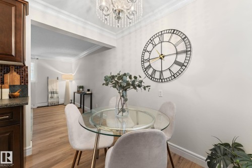 Crown molding details, wood-finish flooring, and recessed ceiling lighting - #106 10735 81 Av Nw, Edmonton, AB 