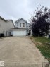 Two-story residence with light blue siding - 8715 11 Avenue Sw, Edmonton, AB 