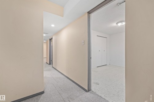 Hallway featuring recessed lighting, light-toned walls, and a grey carpeted floor - 13320 123 Street Nw, Edmonton, AB - Indoor Photo Showing Other Room