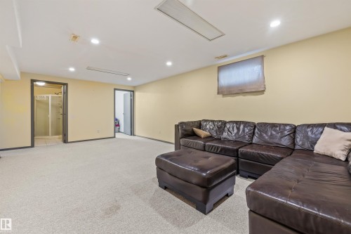 Carpeted room featuring recessed lighting and a window - 13320 123 Street Nw, Edmonton, AB - Indoor