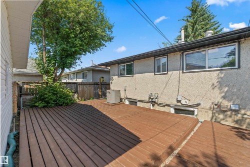 Spacious outdoor deck with rich wood-finish planks - 13320 123 Street Nw, Edmonton, AB - Outdoor With Deck Patio Veranda With Exterior