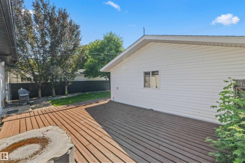 Expansive outdoor decking features a wood-finish surface - 13320 123 Street Nw, Edmonton, AB - Outdoor With Exterior