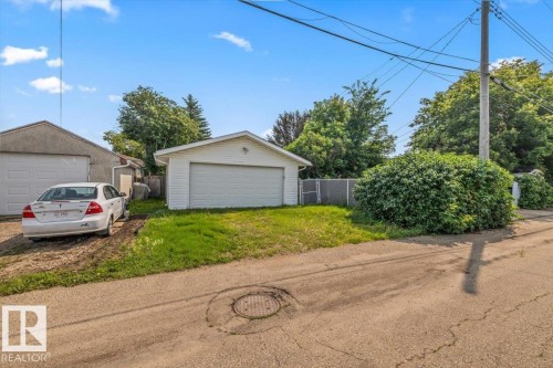 Two detached garages with white garage doors - 13320 123 Street Nw, Edmonton, AB - Outdoor