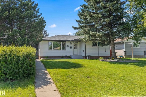 White siding exterior with black trim windows - 13320 123 Street Nw, Edmonton, AB - Outdoor