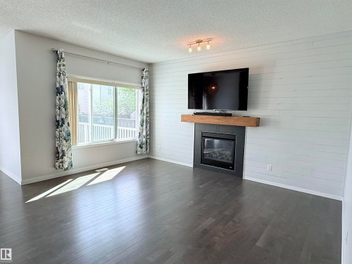 7819 173 Avenue Nw, Edmonton, AB - Indoor Photo Showing Living Room With Fireplace