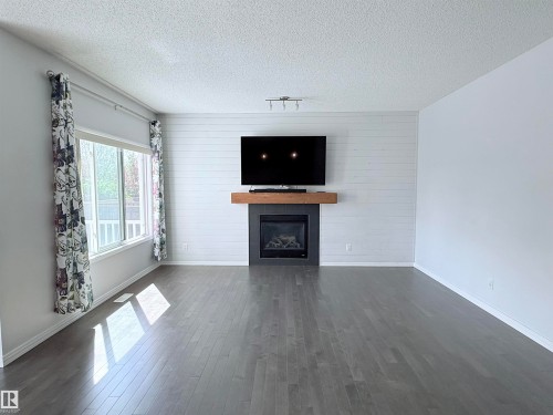 7819 173 Avenue Nw, Edmonton, AB - Indoor Photo Showing Living Room With Fireplace