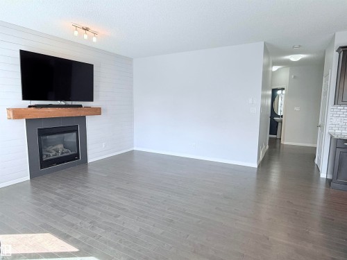 7819 173 Avenue Nw, Edmonton, AB - Indoor Photo Showing Living Room With Fireplace