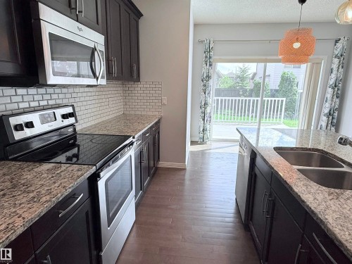 7819 173 Avenue Nw, Edmonton, AB - Indoor Photo Showing Kitchen With Stainless Steel Kitchen With Double Sink With Upgraded Kitchen