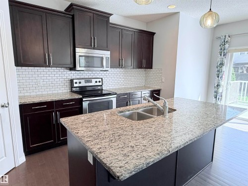 7819 173 Avenue Nw, Edmonton, AB - Indoor Photo Showing Kitchen With Stainless Steel Kitchen With Double Sink With Upgraded Kitchen