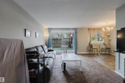 Hardwood-finish flooring, sliding glass door with exterior access, contemporary chandelier - 
