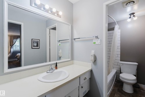 Vanity with an integrated sink, polished chrome faucet, and ample counter space - #126 5125 Riverbend Rd Nw, Edmonton, AB 