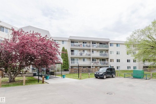 Multi-story building featuring multiple private balconies and an integrated covered entrance - #126 5125 Riverbend Rd Nw, Edmonton, AB 