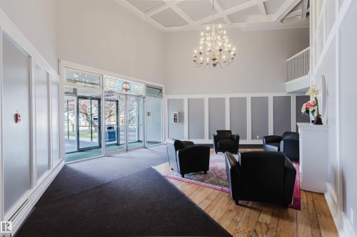 Grand entrance foyer featuring high ceilings and coffered detailing - #126 5125 Riverbend Rd Nw, Edmonton, AB 