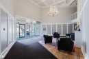Grand entrance foyer featuring high ceilings and coffered detailing - #126 5125 Riverbend Rd Nw, Edmonton, AB 