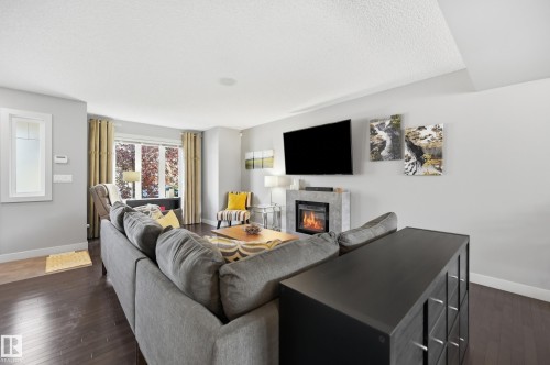 704 176 Street Sw, Edmonton, AB - Indoor Photo Showing Living Room With Fireplace