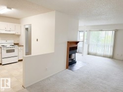 Kitchen with white cabinetry and a built-in range - 