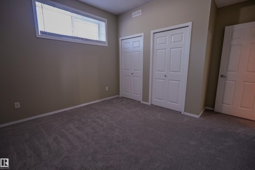 Wall-to-wall carpeting and white trim throughout - 122 142 Selkirk Place, Leduc, AB 