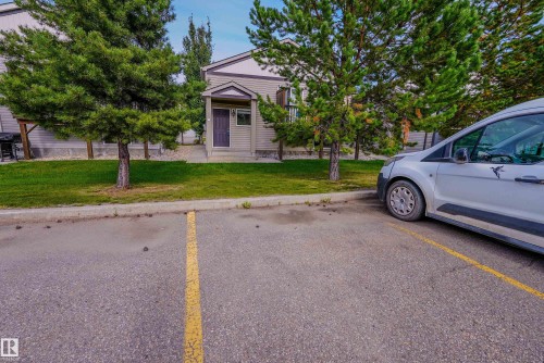 Paved parking area with marked spaces - 122 142 Selkirk Place, Leduc, AB 