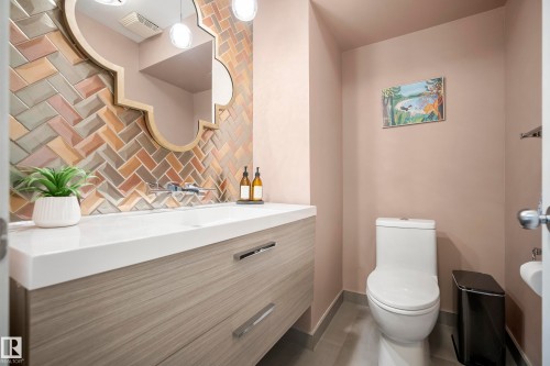 Wood-finish vanity with an integrated rectangular sink - 11006 64 Avenue Nw, Edmonton, AB 
