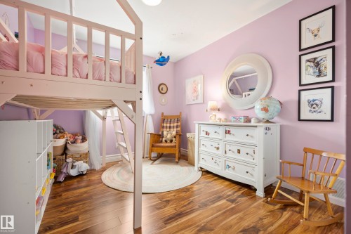 Wood-finish flooring provides a warm aesthetic - 11006 64 Avenue Nw, Edmonton, AB 