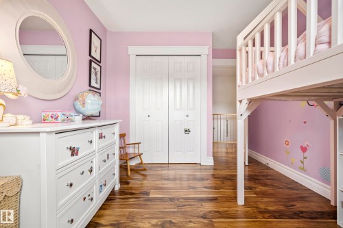 Warm wood-finish flooring complements the interior space - 11006 64 Avenue Nw, Edmonton, AB 