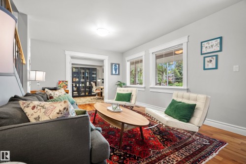Hardwood flooring, white window trim, and ceiling-mounted lighting - 11006 64 Avenue Nw, Edmonton, AB 