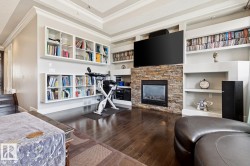 with a built in shelves and fireplace - 