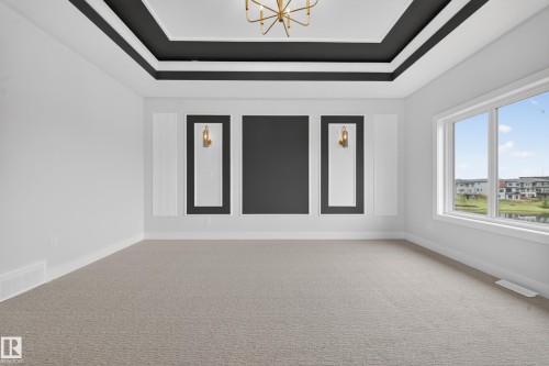 Tray ceiling with black trim and a gold-tone chandelier - 8737 Mayday Lane Sw, Edmonton, AB 
