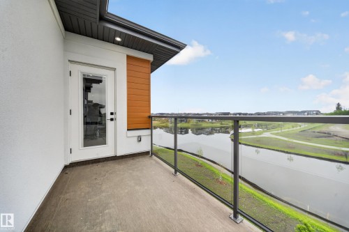 Private balcony featuring a concrete surface and a glass railing system - 8737 Mayday Lane Sw, Edmonton, AB 